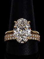 5.0CT Oval-Cut Moissanite · Hidden Halo Solitaire · Double-Row Pavé Band · Yellow Gold
